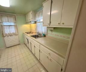 224 Pinewood Road Baltimore, MD 21222 - Photo 7 of 10 a kitchen with stainless steel appliances a stove a sink and a refrigerator