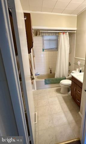 224 Pinewood Road Baltimore, MD 21222 - Photo 8 of 10 a bathroom with a sink a toilet a mirror and shower