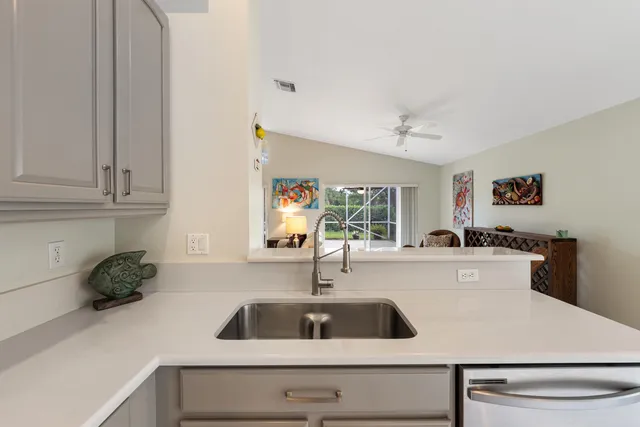 a kitchen with a sink and cabinets