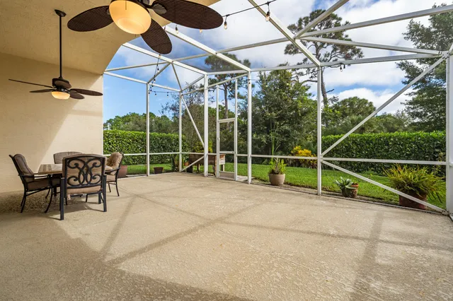 a view of a chair and table in the patio