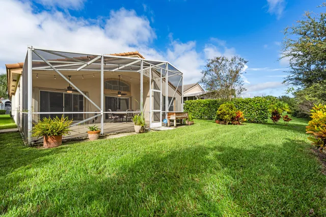 a view of an house with backyard space and garden