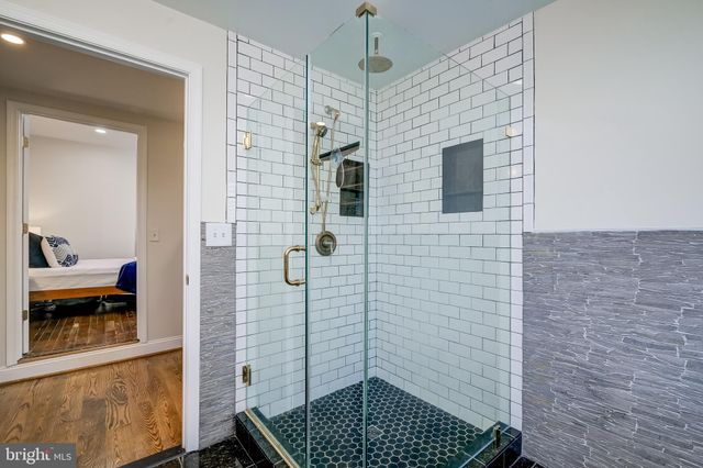 a bathroom with a toilet a sink and shower