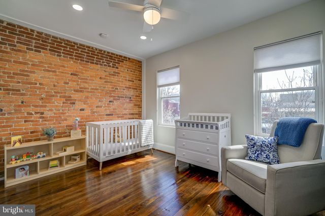 a bathroom with a sink a toilet and window