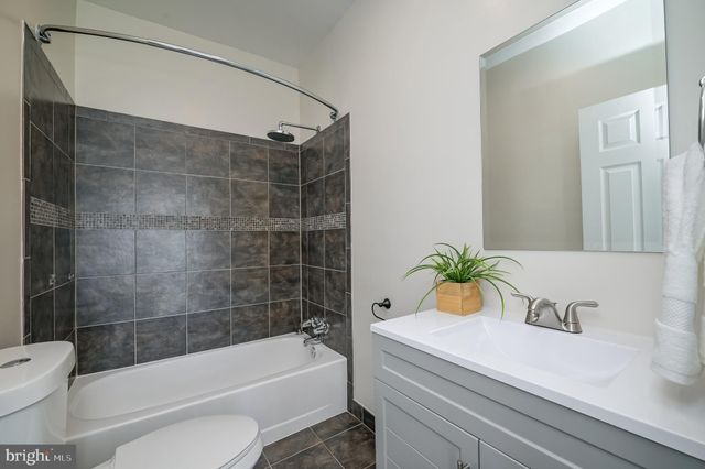 a view of a balcony with wooden floor