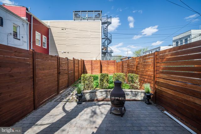a view of a chairs and table in a patio