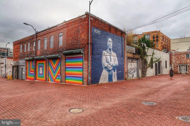 a view of swimming pool with an outdoor seating