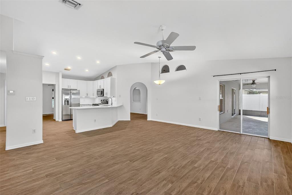 2113 Wolf Ridge Lane Mount Dora, FL 32757 - Photo 15 of 49 a view of a kitchen with wooden floor and a kitchen