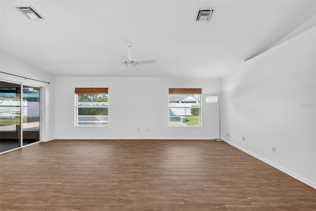 2113 Wolf Ridge Lane Mount Dora, FL 32757 - Photo 19 of 49 an empty room with windows