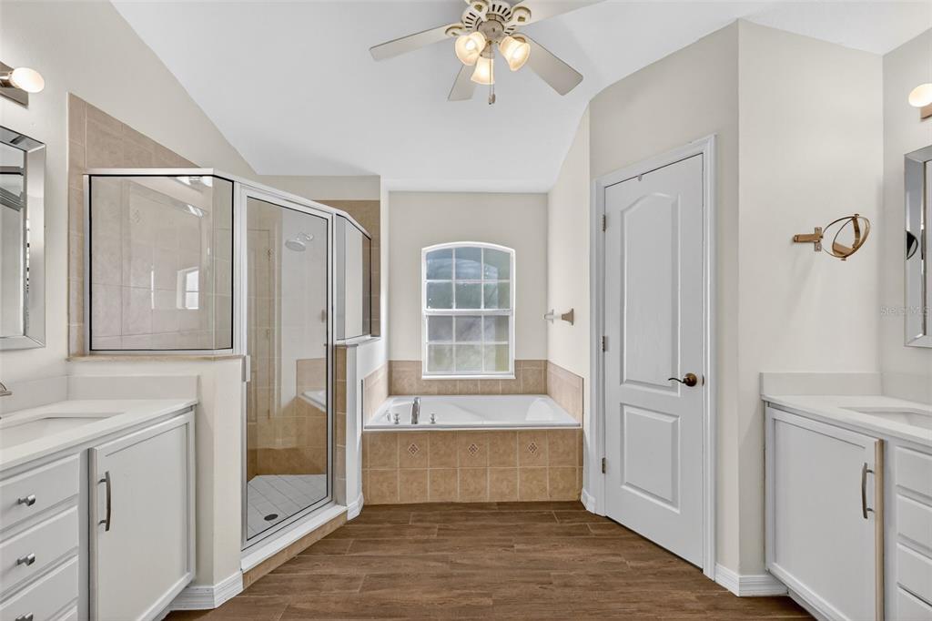 2113 Wolf Ridge Lane Mount Dora, FL 32757 - Photo 27 of 49 a bathroom with a tub shower and sink