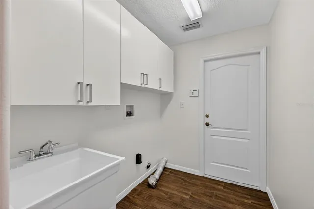 a bathroom with a bathtub and sink
