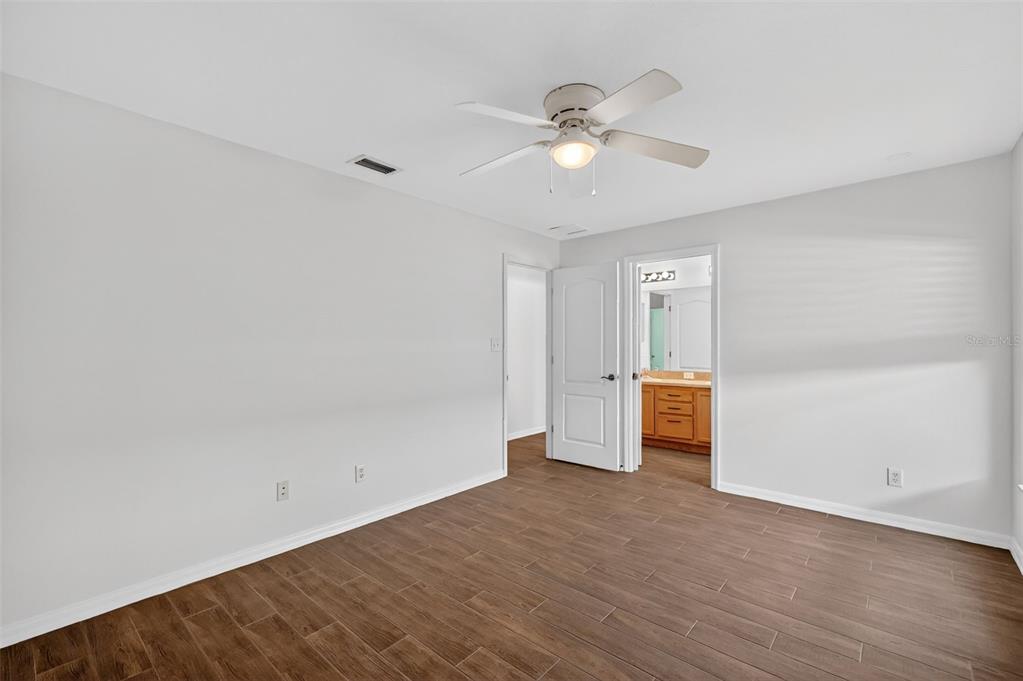 2113 Wolf Ridge Lane Mount Dora, FL 32757 - Photo 34 of 49 wooden floor in an empty room