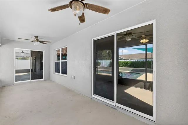 wooden floor in an empty room with a glass door