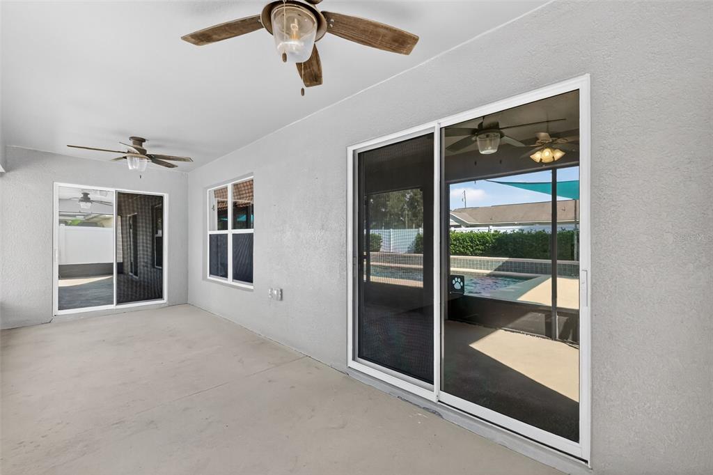 2113 Wolf Ridge Lane Mount Dora, FL 32757 - Photo 40 of 49 wooden floor in an empty room with a glass door