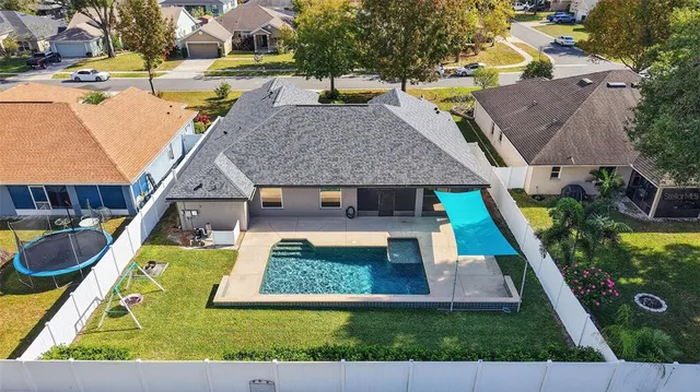 an aerial view of a house with swimming pool