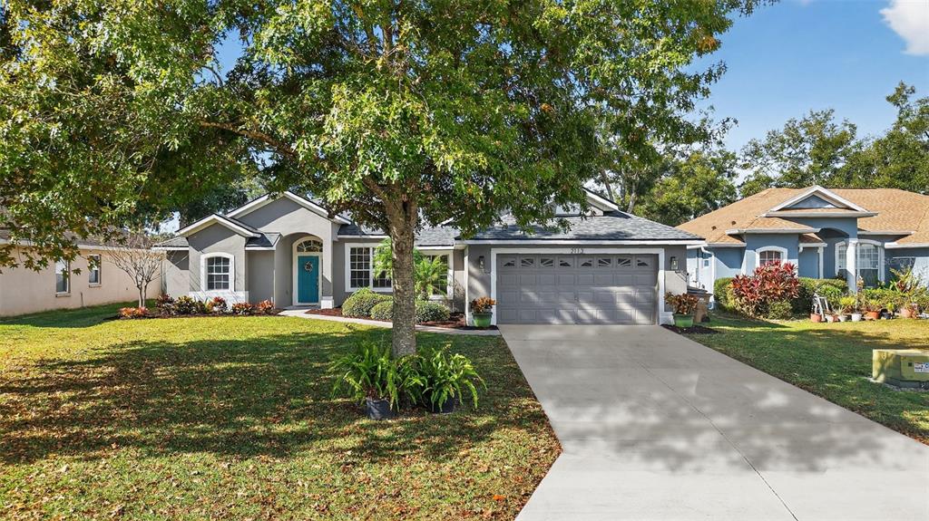2113 Wolf Ridge Lane Mount Dora, FL 32757 - Photo 5 of 49 a front view of a house with a yard