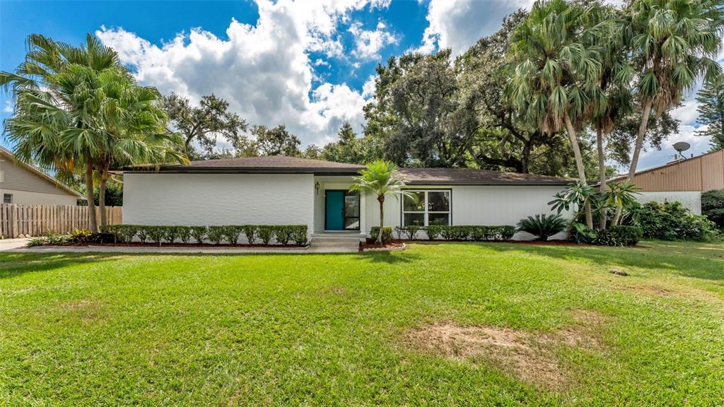 a front view of house with yard and seating