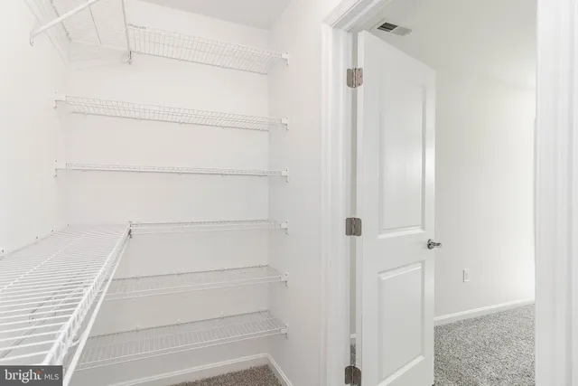 a view of a livingroom with a ceiling fan and window