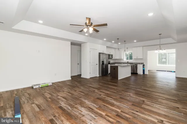 a view of a kitchen with a stove cabinets and wooden floor