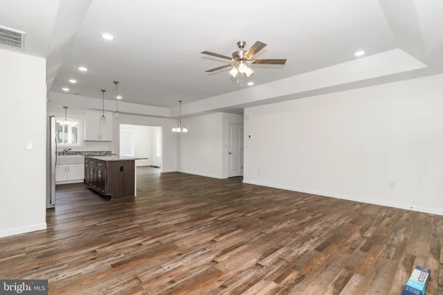 a view of a kitchen with a stove cabinets and wooden floor