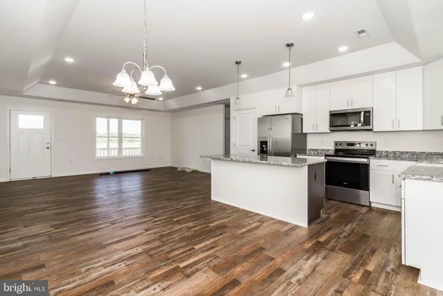 a view of a kitchen with a sink and a window