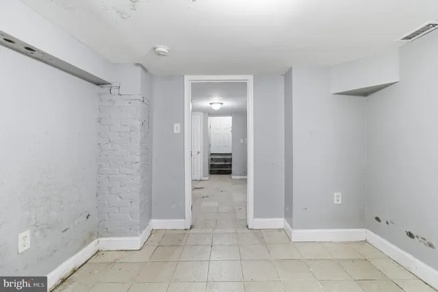 a view of a bathroom with sink and shower