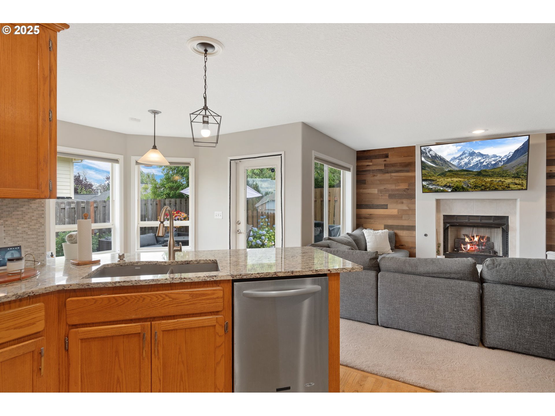 2326 Southeast Robin Lane Gresham, OR 97080 - Photo 13 of 33 a living room with granite countertop furniture a fireplace and windows