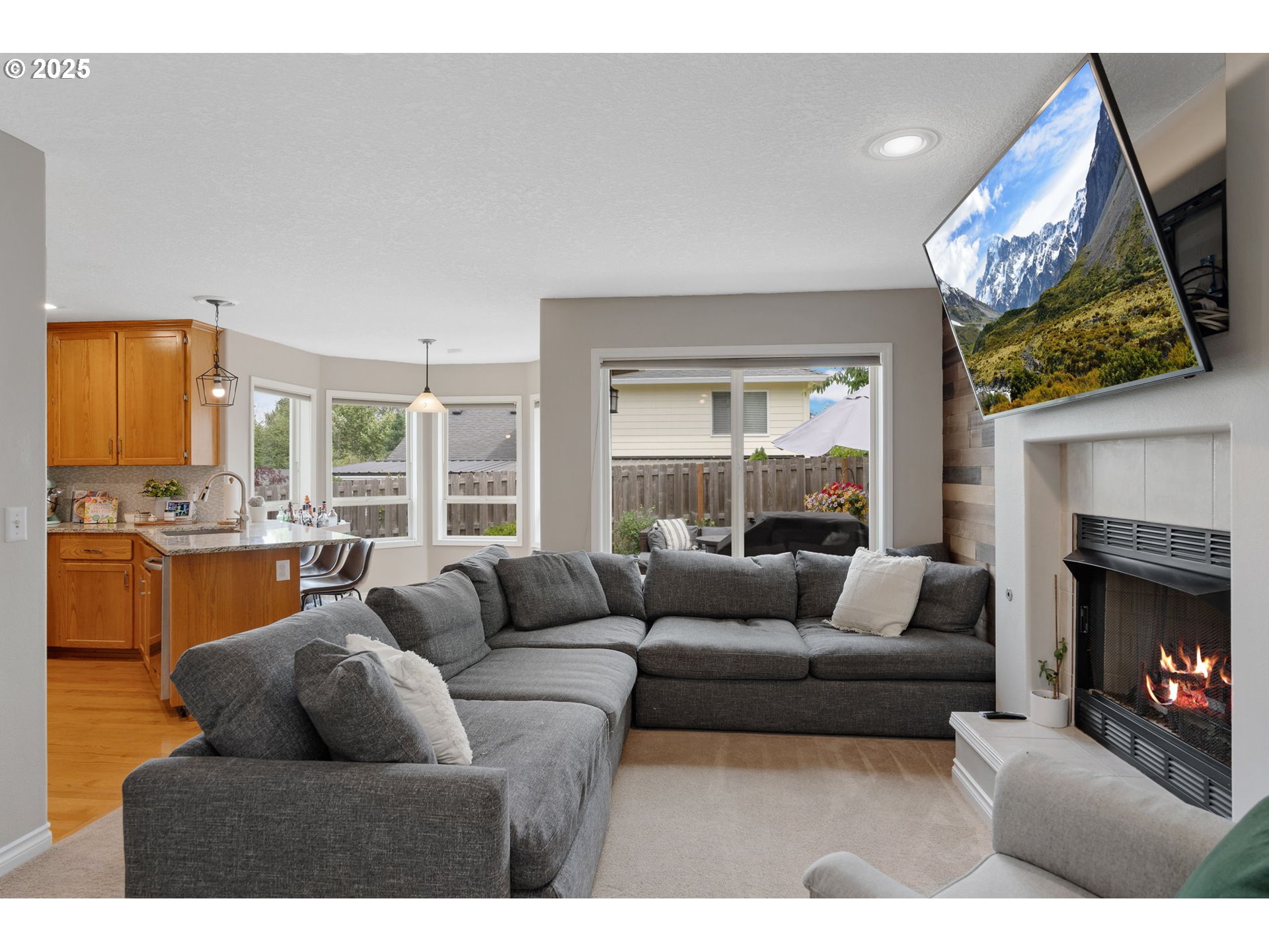2326 Southeast Robin Lane Gresham, OR 97080 - Photo 14 of 33 a living room with furniture a fireplace and a large window