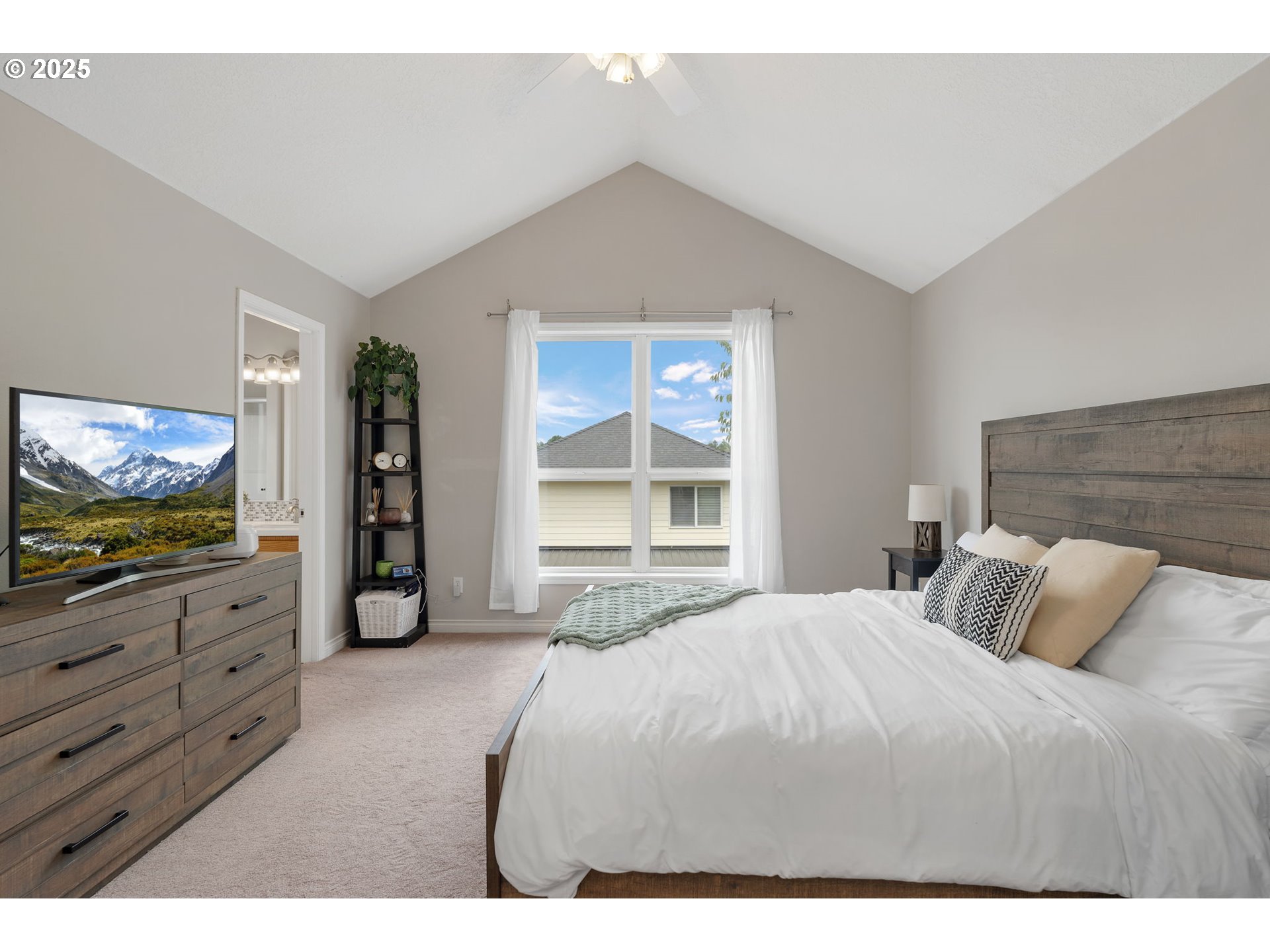 2326 Southeast Robin Lane Gresham, OR 97080 - Photo 18 of 33 a bedroom with a bed and a flat screen tv
