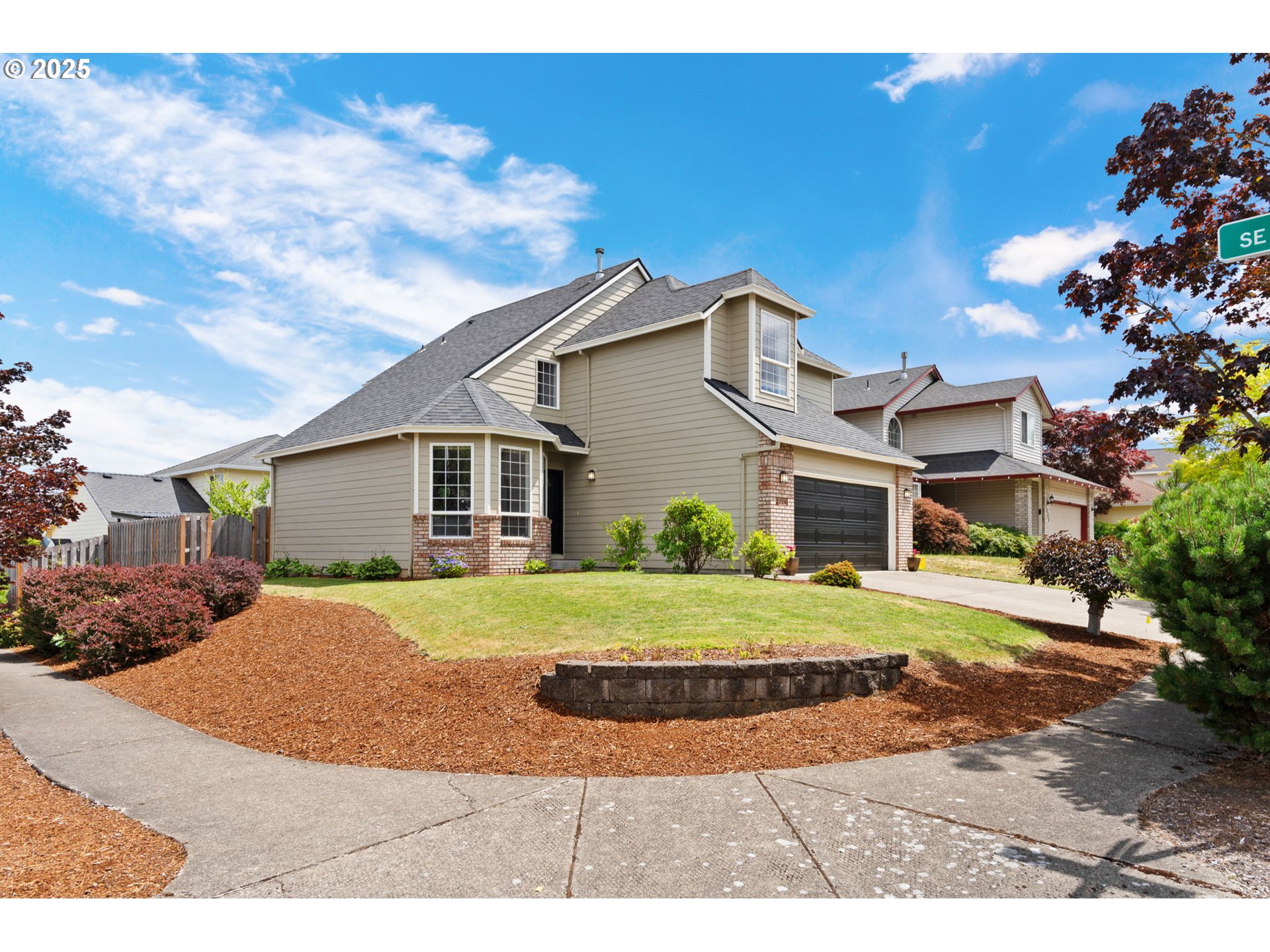 2326 Southeast Robin Lane Gresham, OR 97080 - Photo 2 of 33 a front view of a house with a yard