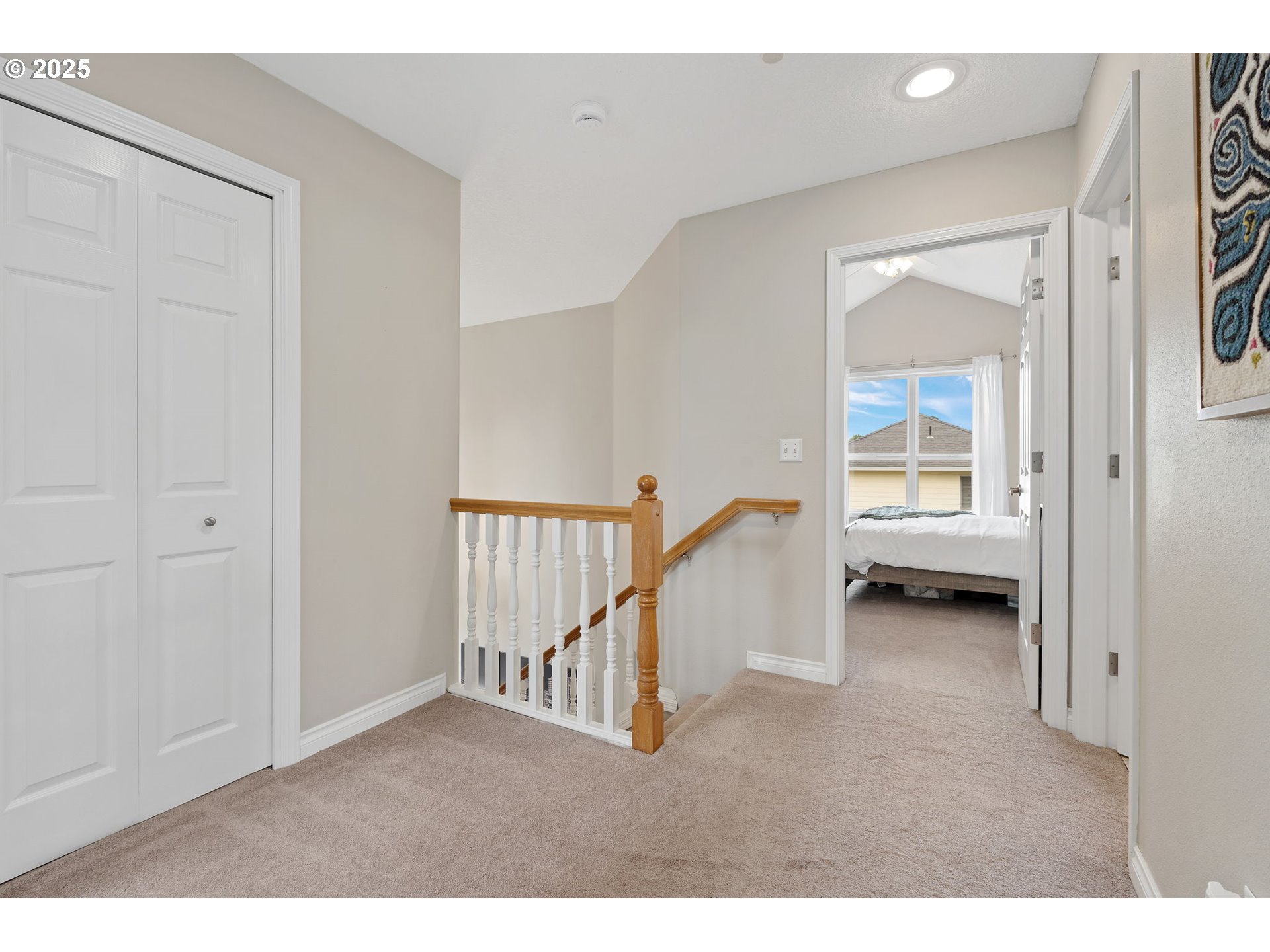2326 Southeast Robin Lane Gresham, OR 97080 - Photo 21 of 33 a view of a hallway with white walls and stairs