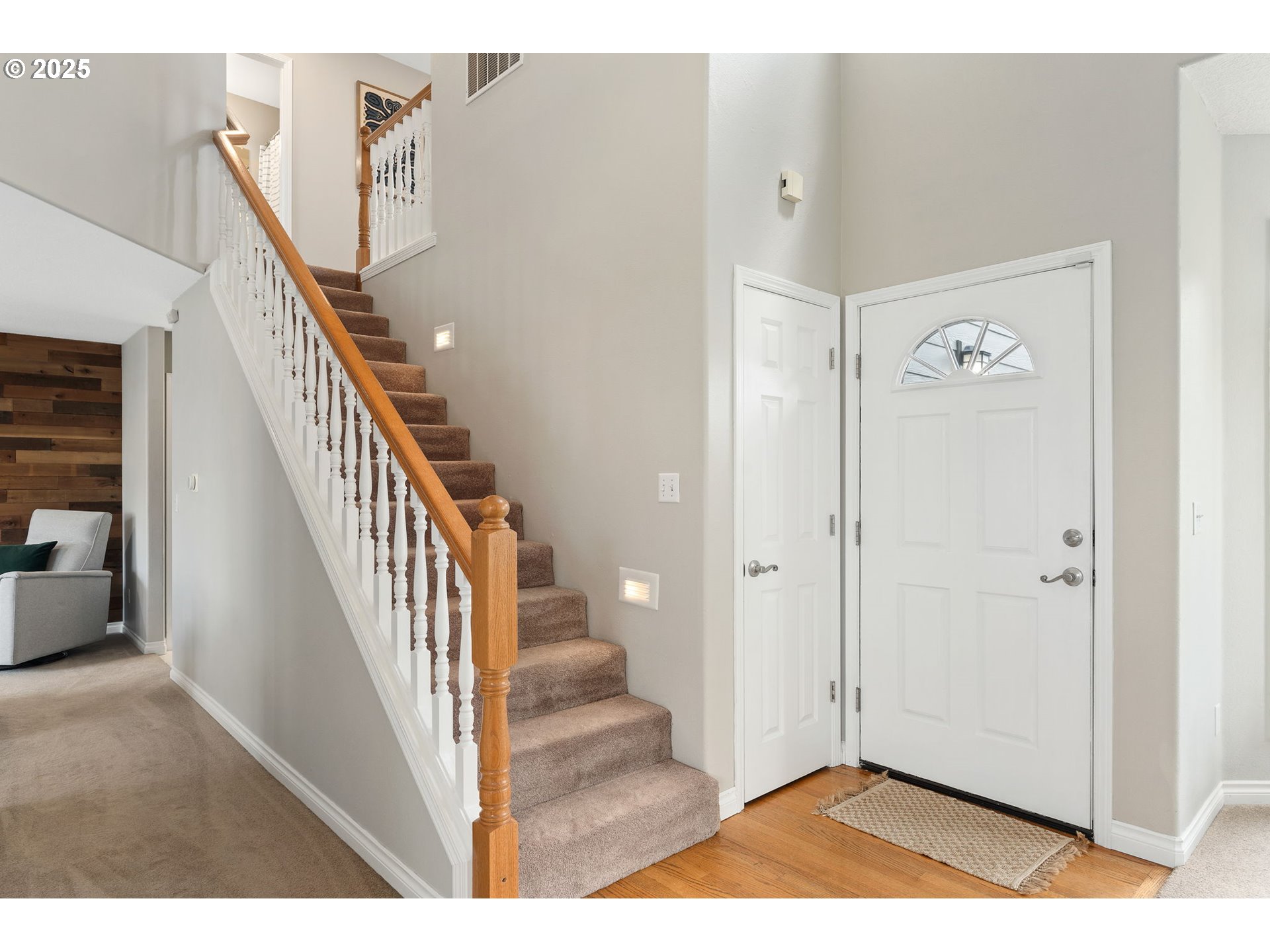 2326 Southeast Robin Lane Gresham, OR 97080 - Photo 5 of 33 a view of a hallway with wooden floor and staircase