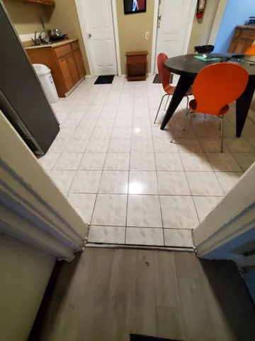 a reading room with wooden floor and furniture