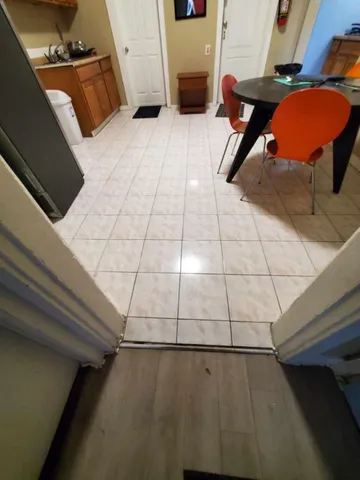 a bedroom with a bed and cabinets