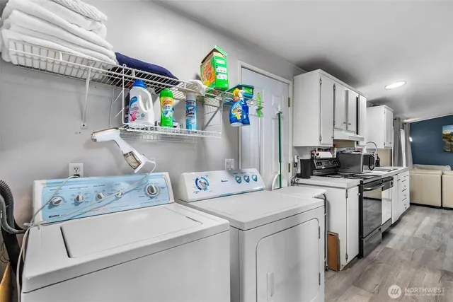 a view of storage and utility room with washer and dryer