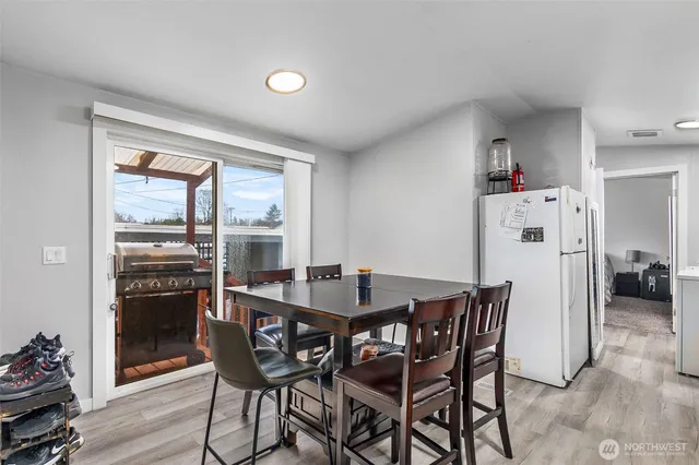 a dining room with furniture and window