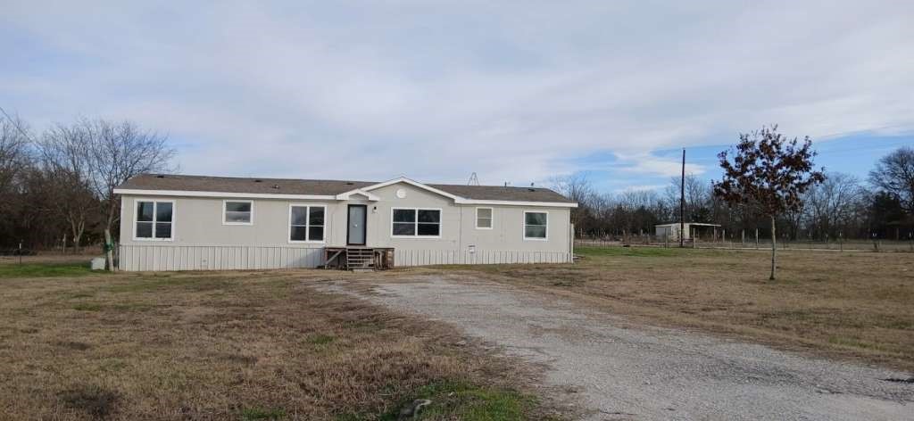 102 Bailey Street Van Alstyne, TX 75495 - Photo 1 of 14 a house with trees in the background