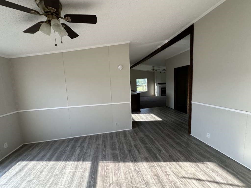 102 Bailey Street Van Alstyne, TX 75495 - Photo 13 of 14 wooden floor in an empty room with a window