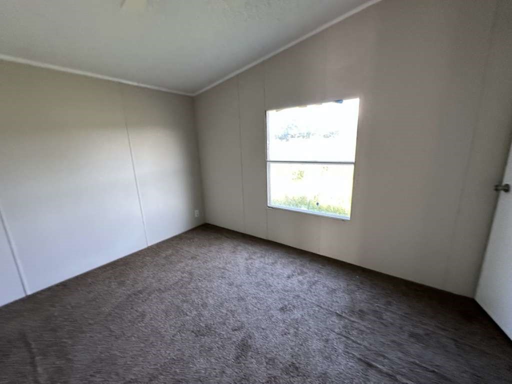 102 Bailey Street Van Alstyne, TX 75495 - Photo 6 of 14 an empty room with a window