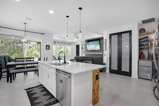 a kitchen with counter top space a sink stainless steel appliances and cabinets