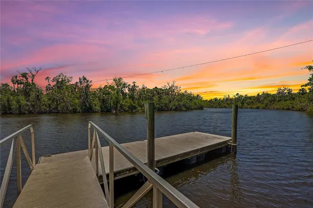 a pathway of a house with a yard