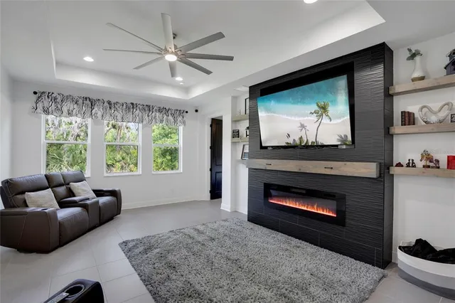 a living room with furniture and kitchen view
