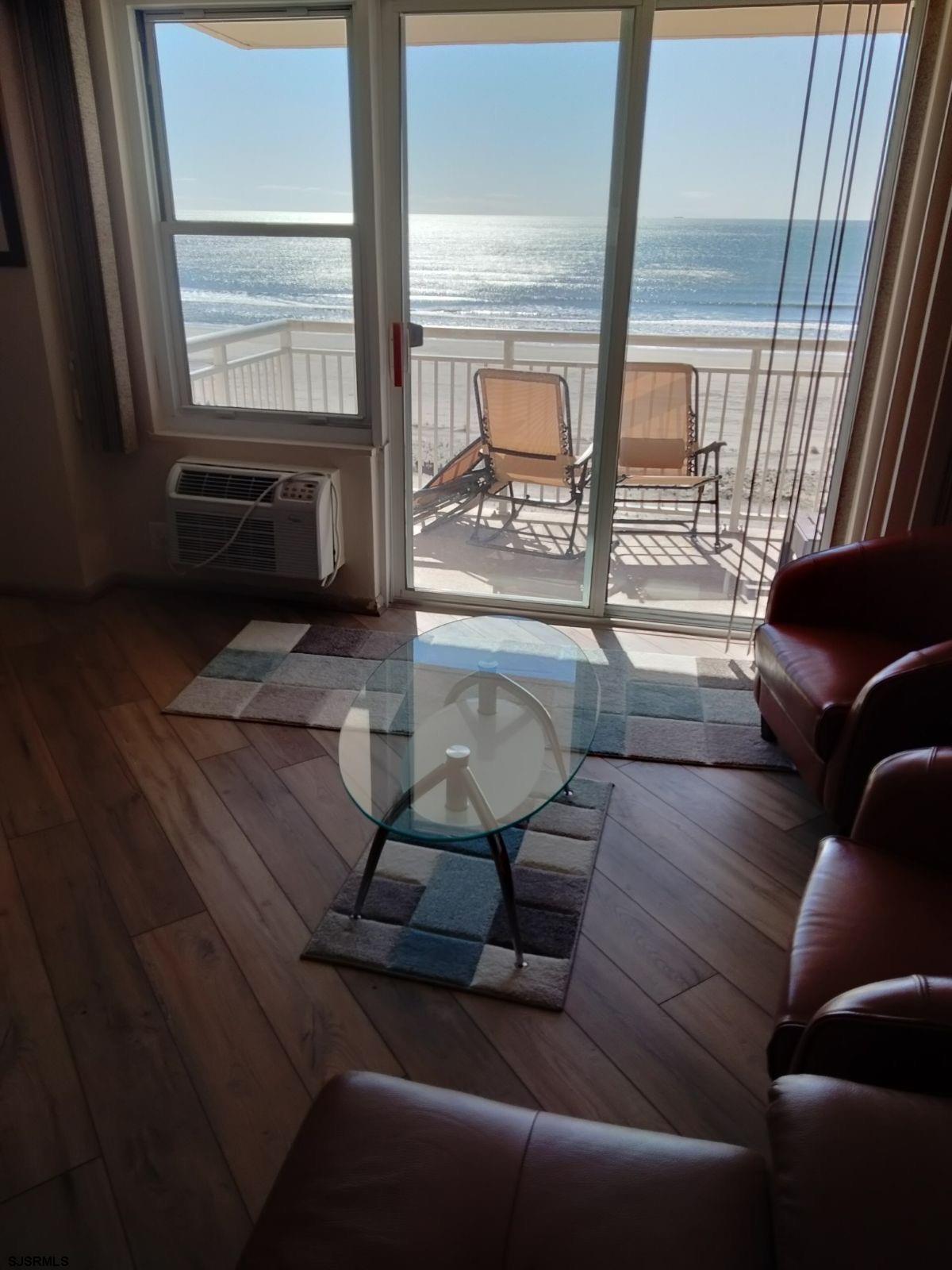 9400 Atlantic Avenue, Unit 709 Margate City, NJ 08402 - Photo 6 of 11 a living room with furniture and a large window