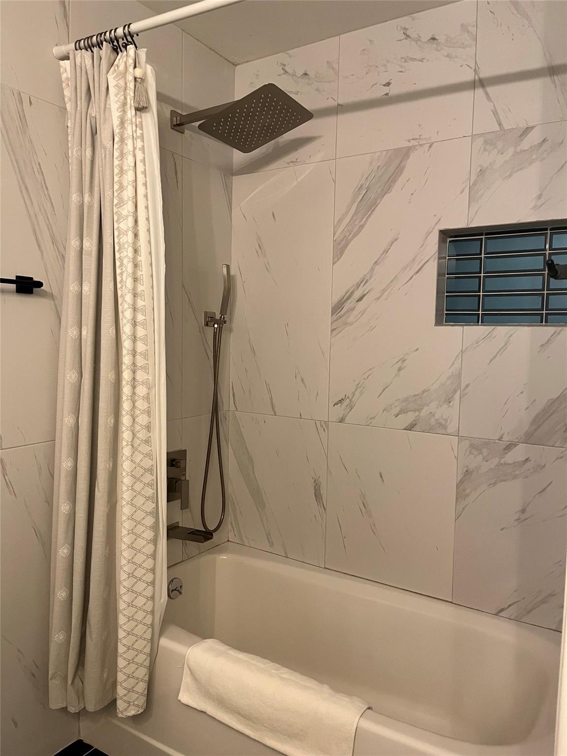 8418 Seminary Ridge Drive Austin, TX 78745 - Photo 11 of 19 a bathroom with a shower and a bathtub