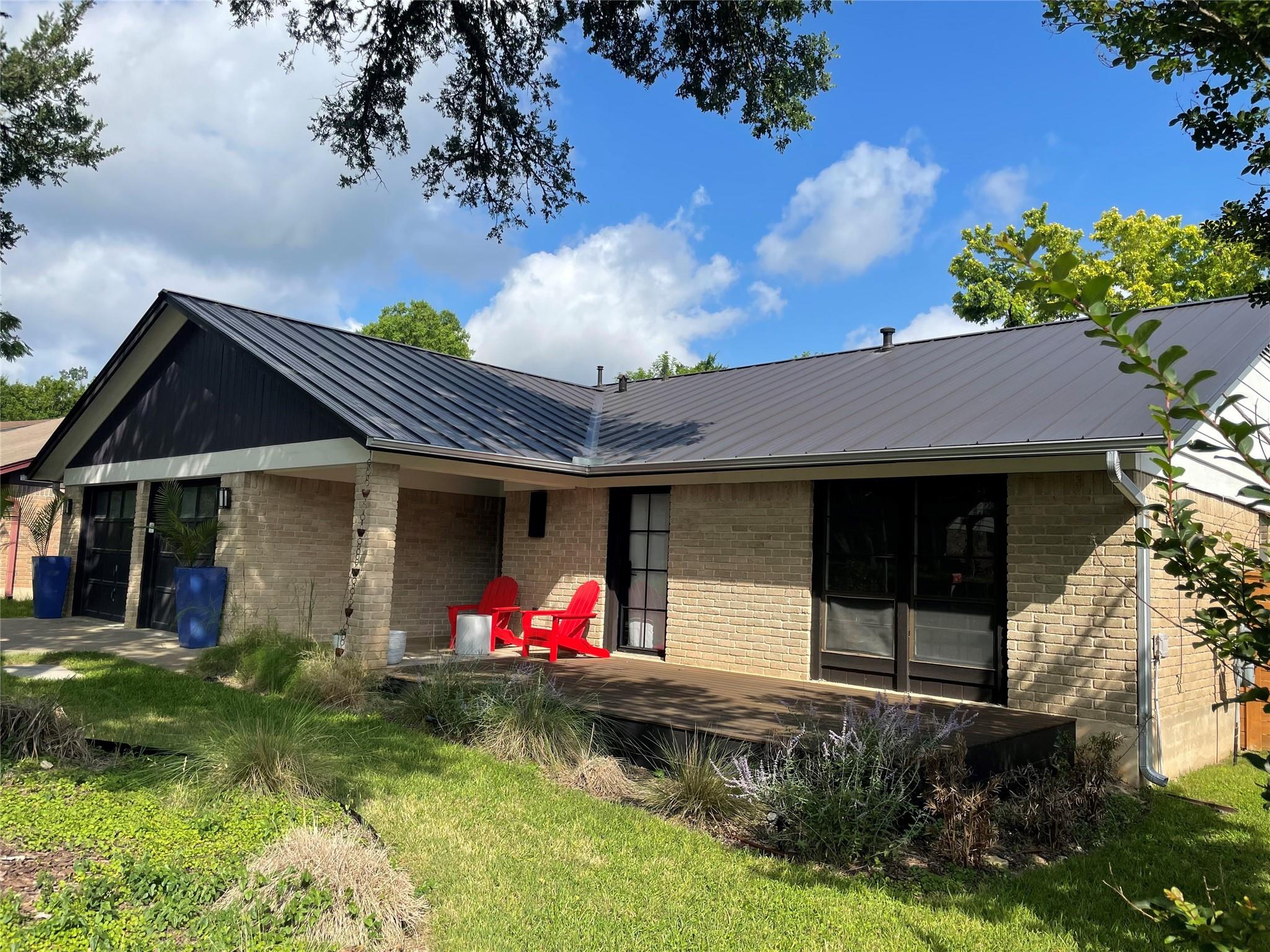 8418 Seminary Ridge Drive Austin, TX 78745 - Photo 3 of 19 a front view of a house with yard