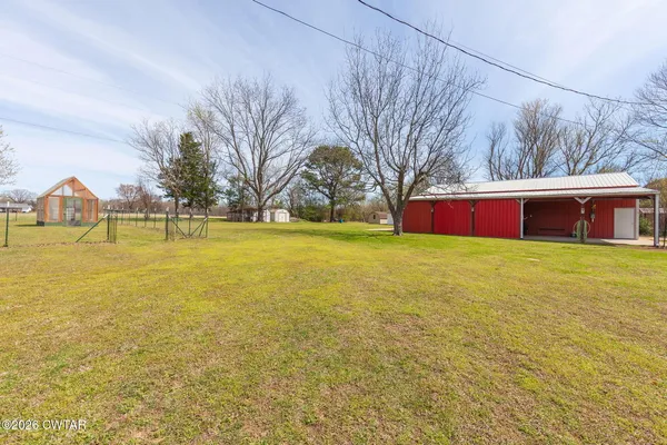 front view of a house with a big yard