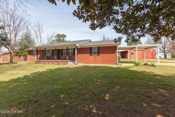 front view of a house with a yard