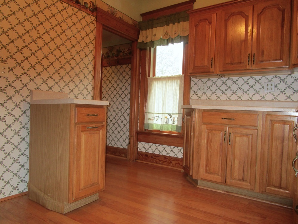 119 West Chestnut Street Compton, IL 61318 - Photo 4 of 27 an entryway with wooden floor and cabinet