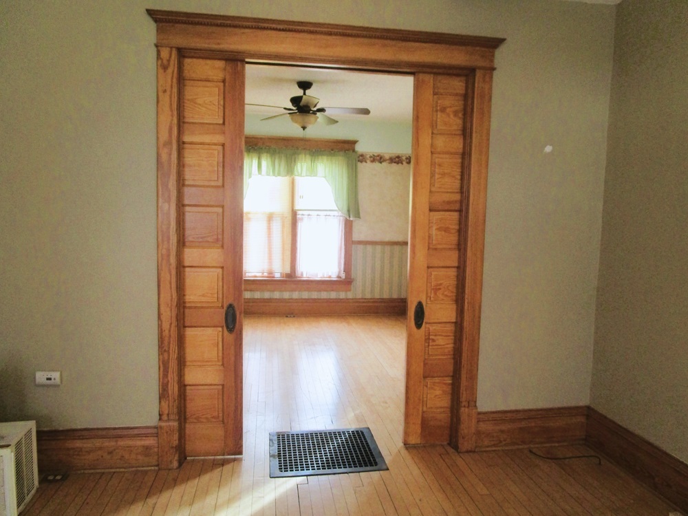 119 West Chestnut Street Compton, IL 61318 - Photo 9 of 27 a view of an empty room with wooden floor and a window