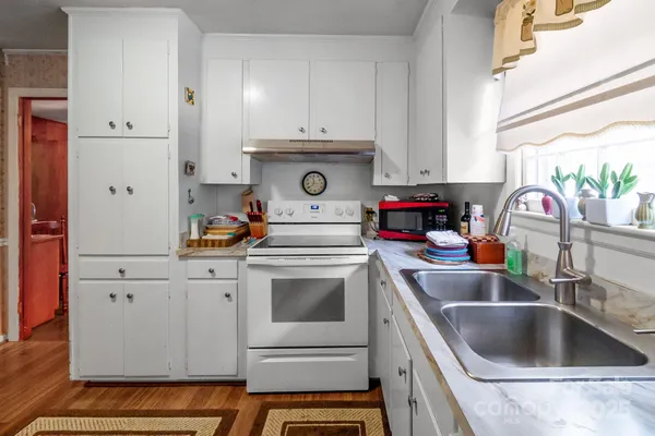 a kitchen with a sink and a window