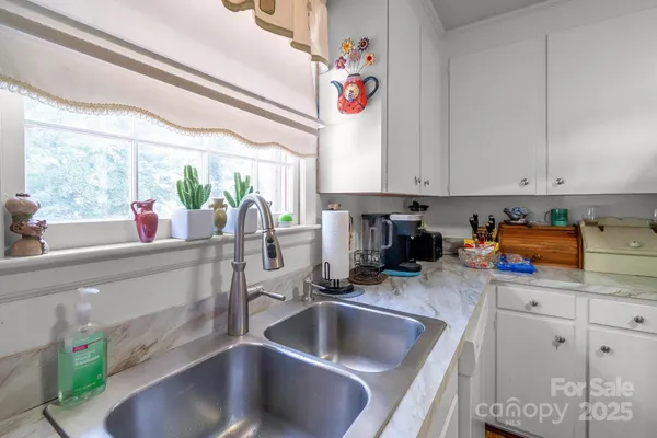 a white refrigerator freezer sitting inside of a kitchen